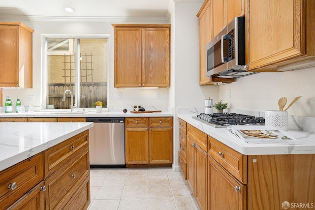 1845 Kern Mountain Way, Antioch, CA 94531 - kitchen with appliances with stainless steel finishes, ornamental molding, a sink, light tile patterned floors, and brown cabinetry
