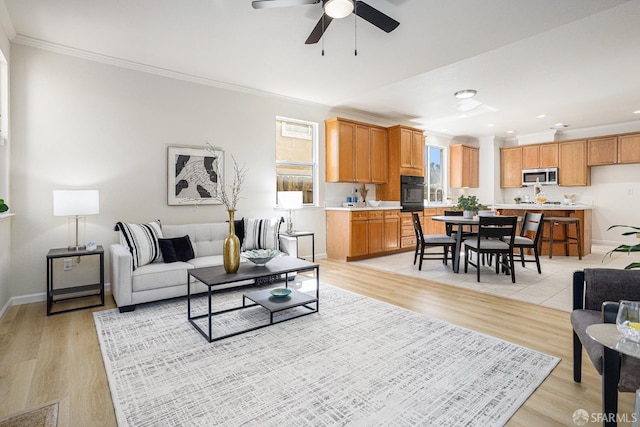 1845 Kern Mountain Way, Antioch, CA 94531 - living room featuring ceiling fan, ornamental molding, light wood-style flooring, recessed lighting, and baseboards