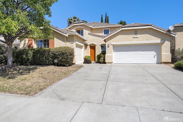 1845 Kern Mountain Way, Antioch, CA 94531 - view of front facade featuring driveway, stucco siding, an attached garage, and a tiled roof