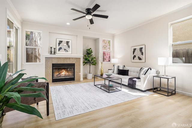 1845 Kern Mountain Way, Antioch, CA 94531 - living room featuring wood finished floors, healthy amount of natural light, a tiled fireplace, crown molding, and recessed lighting