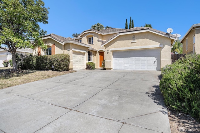 1845 Kern Mountain Way, Antioch, CA 94531 - traditional-style home with a garage, stucco siding, concrete driveway, and a tiled roof