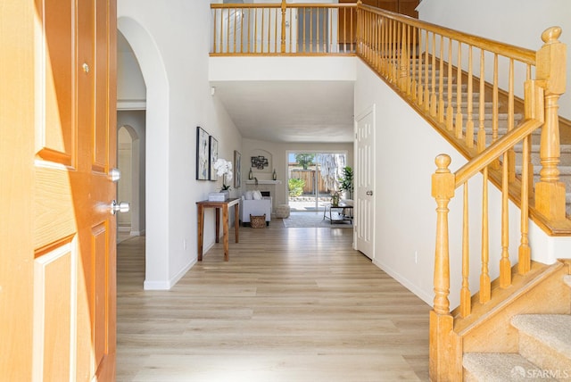 1845 Kern Mountain Way, Antioch, CA 94531 - foyer entrance featuring wood finished floors, arched walkways, stairway, baseboards, and a high ceiling