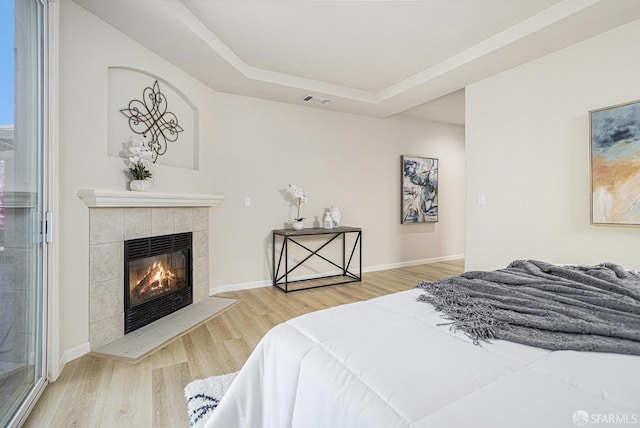 1845 Kern Mountain Way, Antioch, CA 94531 - bedroom featuring wood finished floors, a raised ceiling, a fireplace, and baseboards