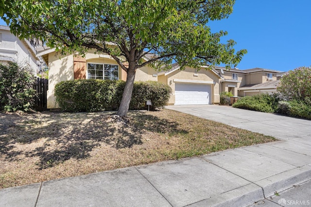 1845 Kern Mountain Way, Antioch, CA 94531 - obstructed view of property featuring concrete driveway, stucco siding, and an attached garage