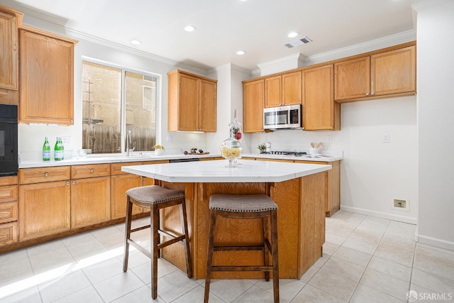 1845 Kern Mountain Way, Antioch, CA 94531 - kitchen featuring stainless steel microwave, ornamental molding, a kitchen island, light countertops, and light tile patterned floors
