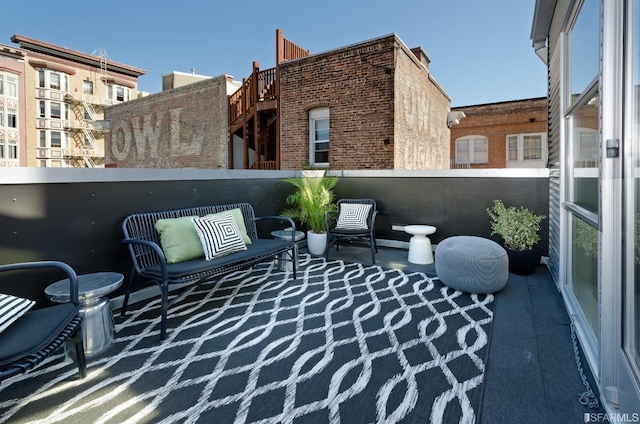 view of patio / terrace with a balcony