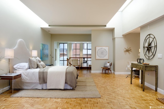 bedroom with light parquet flooring