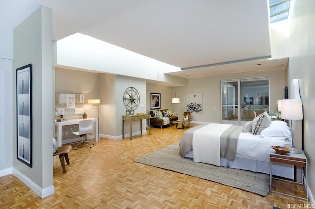 bedroom with light parquet floors and access to outside