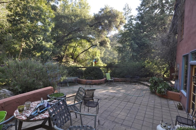 view of patio featuring outdoor dining space