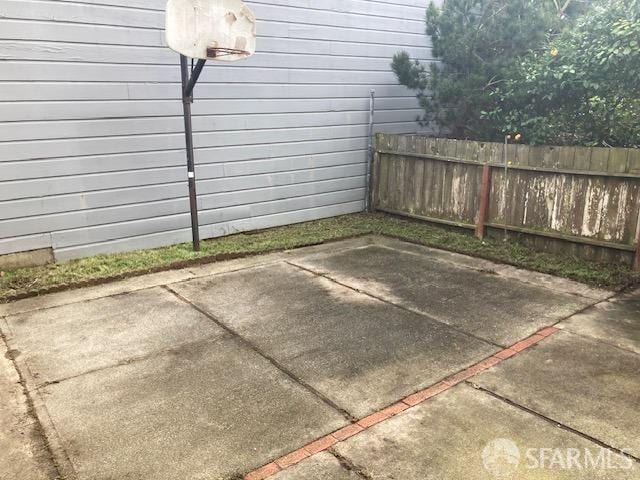 view of patio with basketball hoop