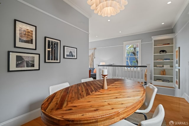 dining room featuring ornamental molding, recessed lighting, wood finished floors, and baseboards