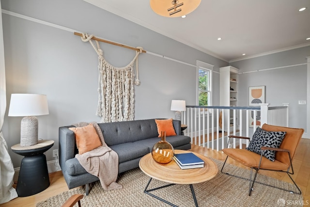 living area featuring recessed lighting, wood finished floors, and crown molding