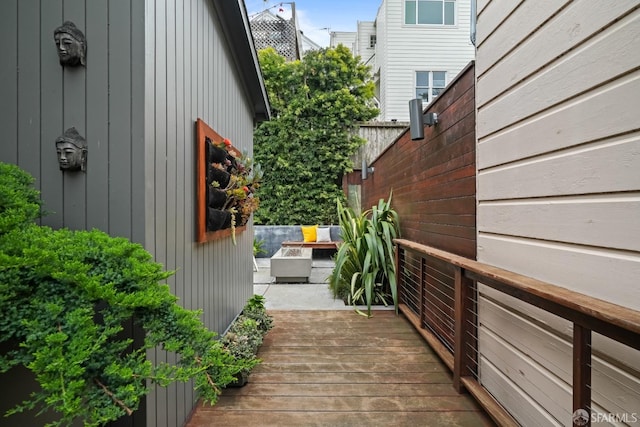 view of side of home featuring a patio and a deck