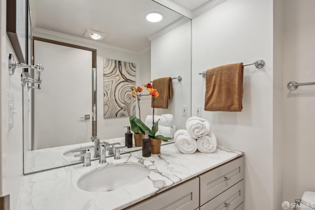 bathroom with vanity and crown molding