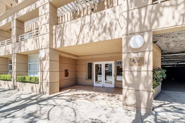 property entrance featuring french doors