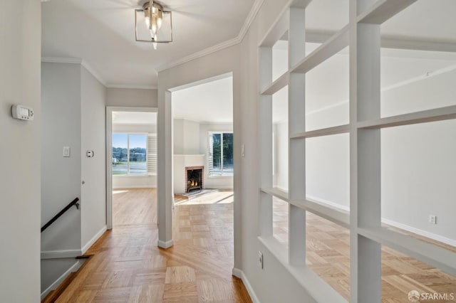 hall featuring crown molding and baseboards