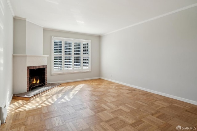 unfurnished living room featuring ornamental molding, a fireplace, and baseboards