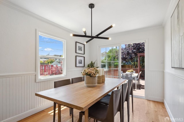 46 Otsego Ave, San Francisco, CA 94112 - dining room featuring a wainscoted wall, light wood-type flooring, and ornamental molding