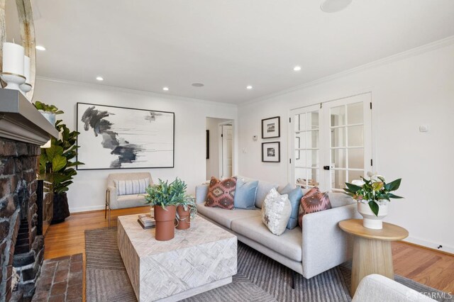 46 Otsego Ave, San Francisco, CA 94112 - living area with a fireplace with flush hearth, french doors, crown molding, recessed lighting, and dark wood-style floors