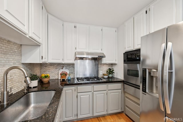46 Otsego Ave, San Francisco, CA 94112 - kitchen with appliances with stainless steel finishes, under cabinet range hood, a warming drawer, and white cabinetry