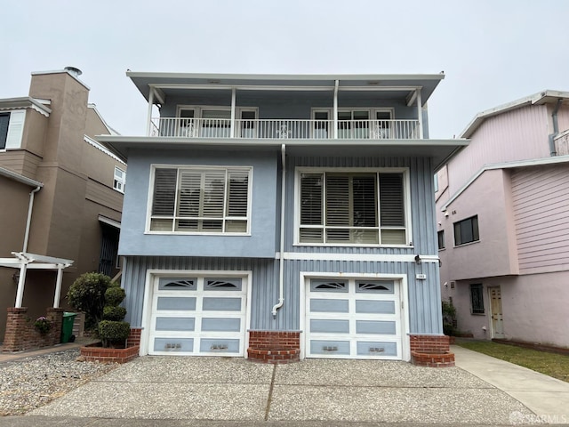 183 Lakeshore Dr, San Francisco, CA 94132 - view of front of home featuring a garage, a balcony, brick siding, board and batten siding, and driveway