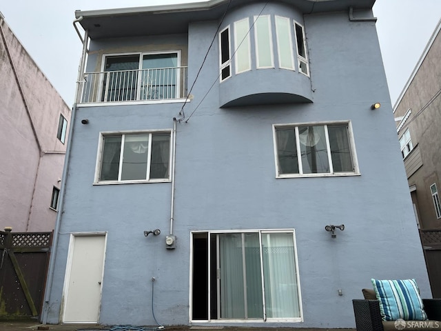 183 Lakeshore Dr, San Francisco, CA 94132 - back of house featuring fence, stucco siding, and a balcony