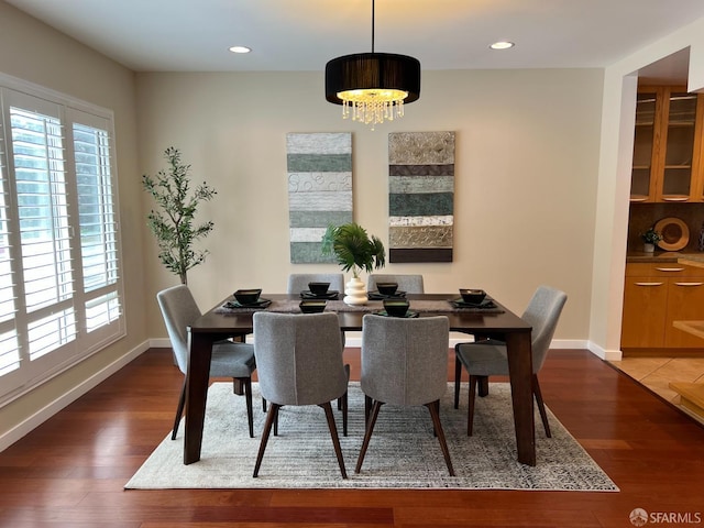 183 Lakeshore Dr, San Francisco, CA 94132 - dining area with a healthy amount of sunlight, baseboards, an inviting chandelier, and wood finished floors