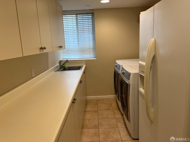 183 Lakeshore Dr, San Francisco, CA 94132 - laundry room with washing machine and dryer, cabinet space, a sink, baseboards, and light tile patterned flooring
