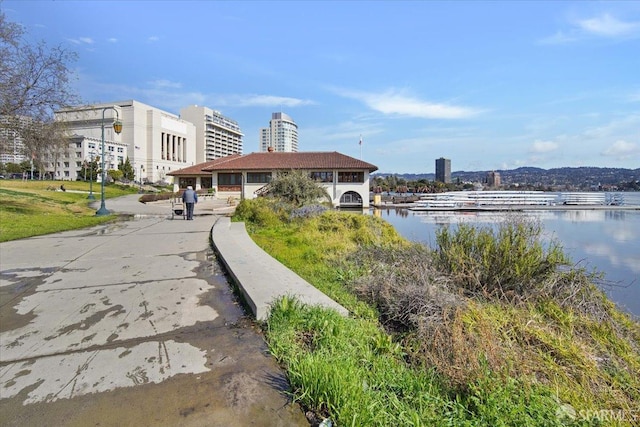 surrounding community featuring a water view