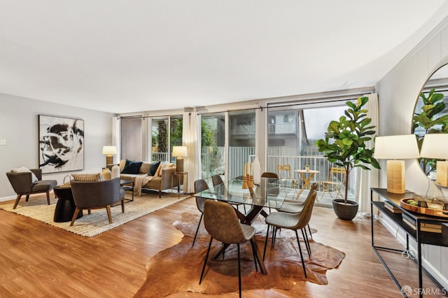 dining space featuring wood finished floors