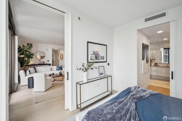 2177 3rd St Unit 421, San Francisco, CA 94107 - bedroom featuring wood finished floors and ensuite bathroom