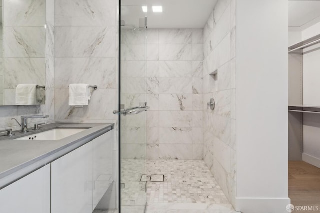 2177 3rd St Unit 421, San Francisco, CA 94107 - bathroom with a shower stall, vanity, wood finished floors, and baseboards