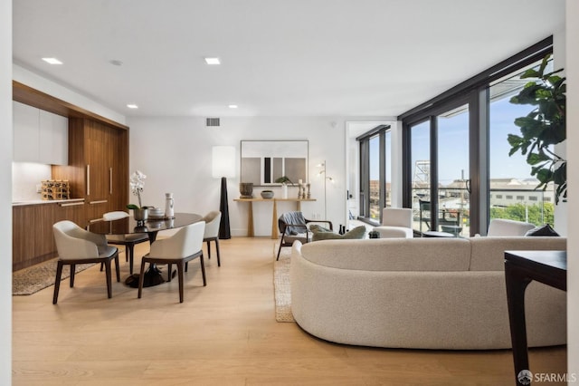 2177 3rd St Unit 421, San Francisco, CA 94107 - living area with light wood finished floors, recessed lighting, and floor to ceiling windows