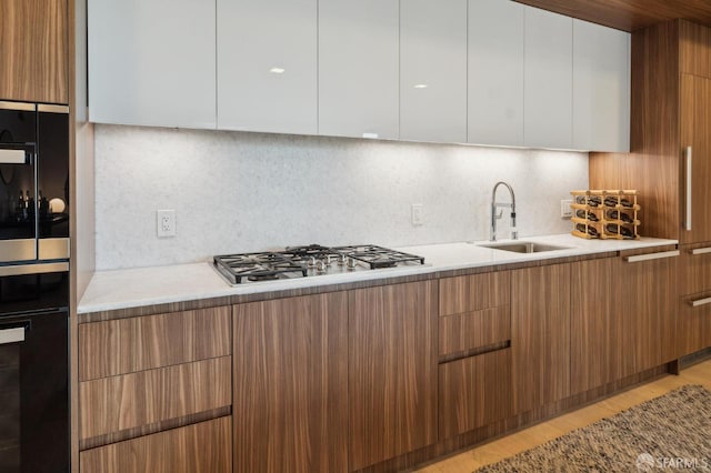 2177 3rd St Unit 421, San Francisco, CA 94107 - kitchen featuring modern cabinets, stainless steel gas cooktop, and a sink