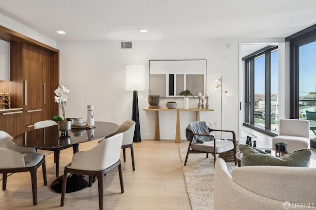 2177 3rd St Unit 421, San Francisco, CA 94107 - dining space with expansive windows, light wood-style flooring, and baseboards
