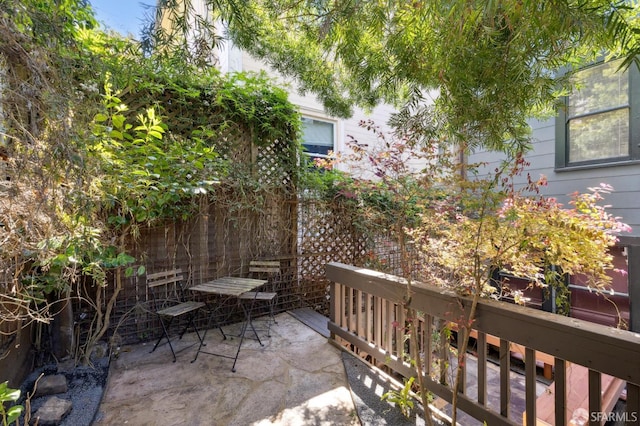 view of patio / terrace featuring fence