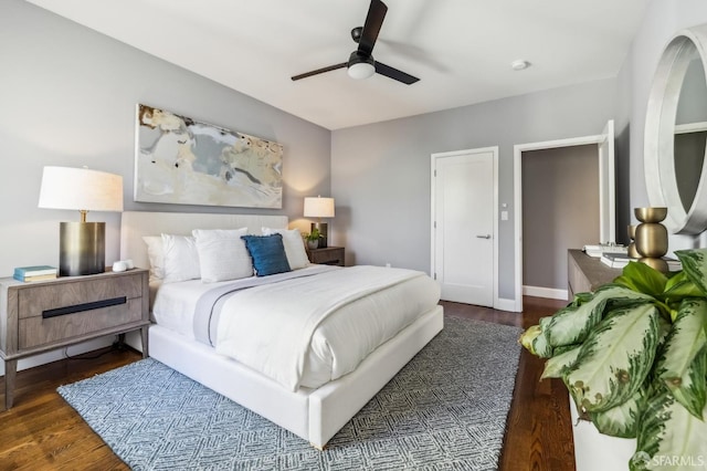 bedroom featuring dark wood-type flooring and ceiling fan