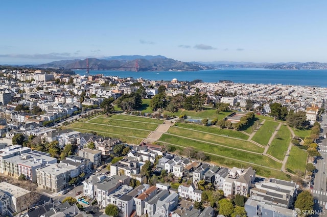 birds eye view of property featuring a water and mountain view