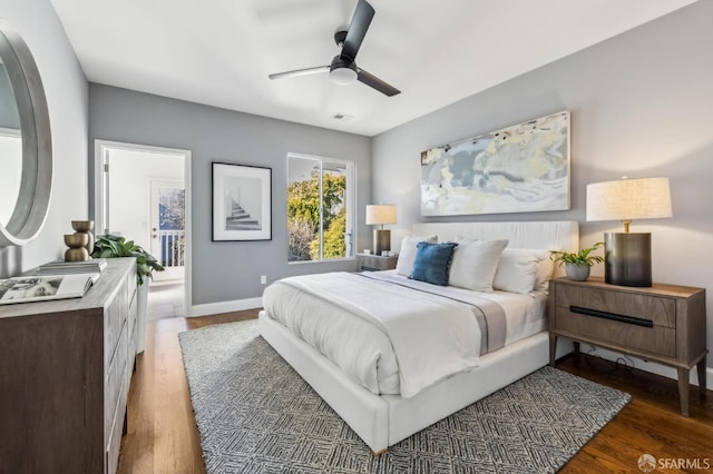 bedroom featuring dark hardwood / wood-style floors and ceiling fan