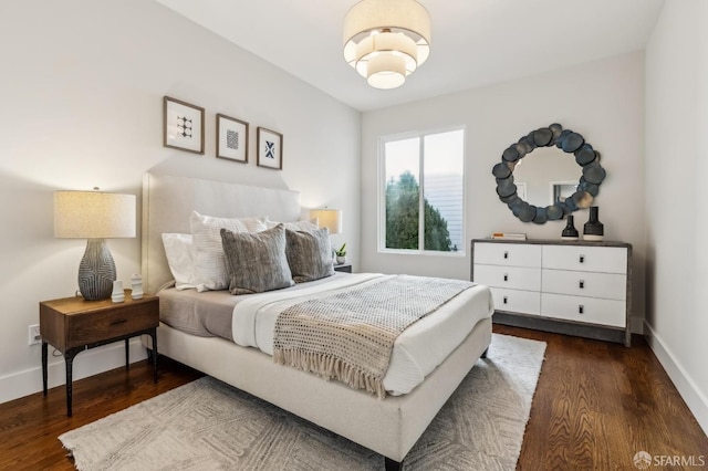 bedroom featuring dark hardwood / wood-style flooring