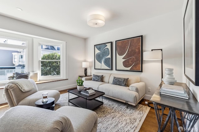 living room with dark hardwood / wood-style flooring