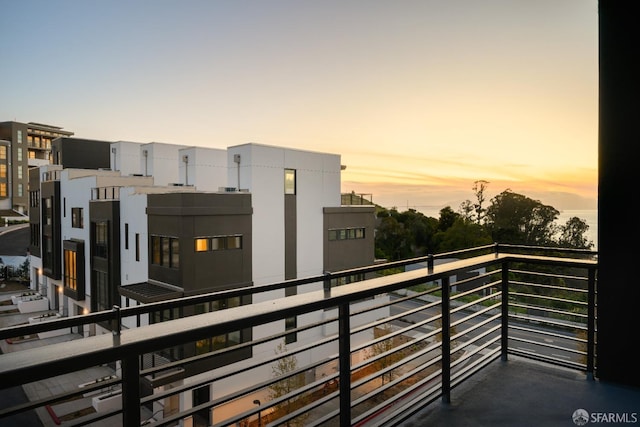 view of balcony at dusk