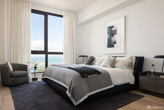 bedroom featuring wood finished floors