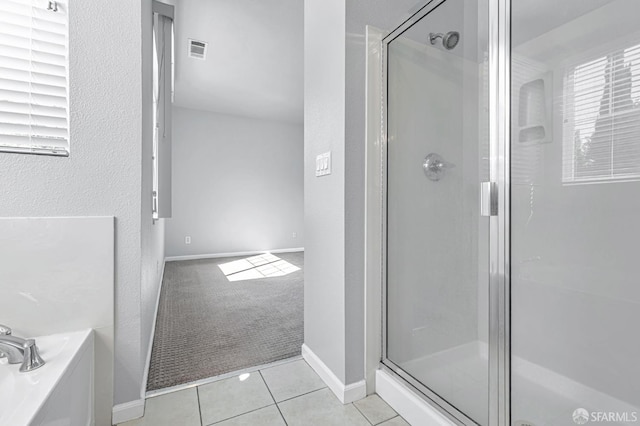 1027 Craftsman Dr, Hercules, CA 94547 - full bathroom with a shower stall, a garden tub, tile patterned flooring, a textured wall, and baseboards