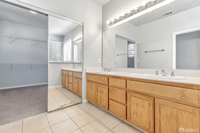 1027 Craftsman Dr, Hercules, CA 94547 - full bath featuring double vanity, tile patterned flooring, and a spacious closet