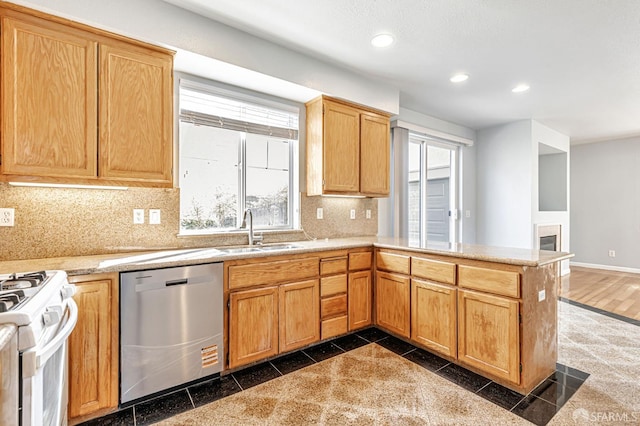 1027 Craftsman Dr, Hercules, CA 94547 - kitchen with stainless steel dishwasher, a sink, recessed lighting, granite floors, and white gas range oven