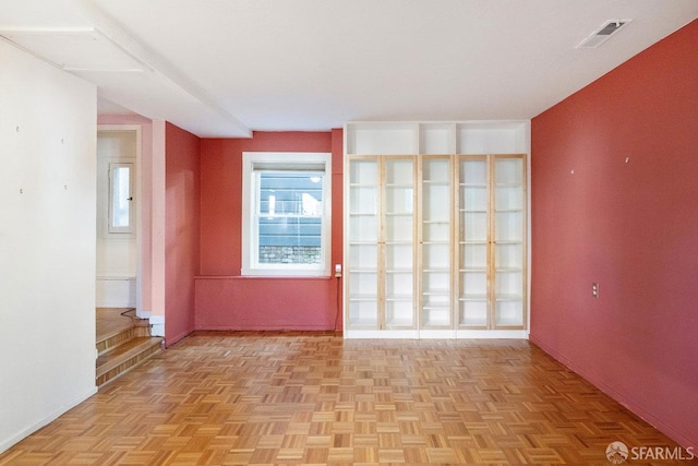 spare room featuring visible vents