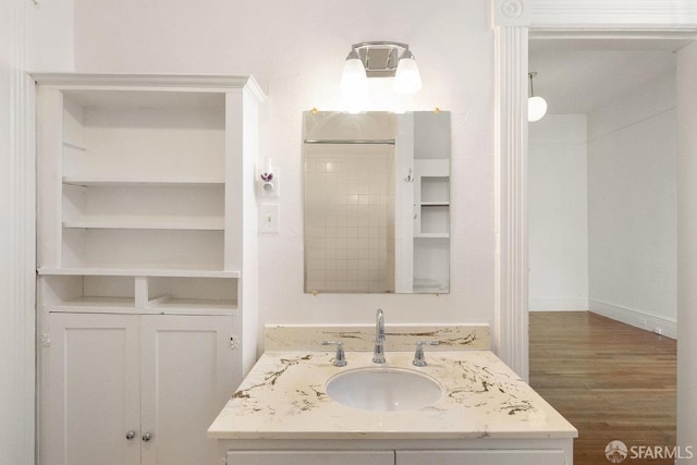 bathroom featuring vanity and wood finished floors