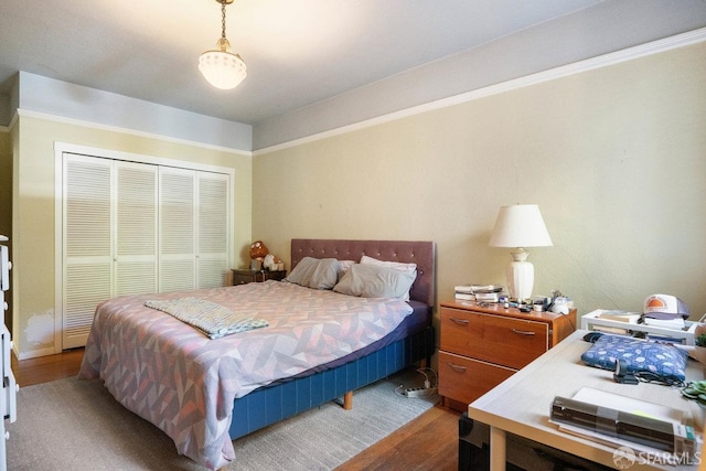 bedroom with a closet and wood finished floors