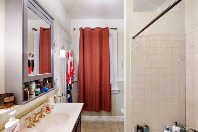 bathroom featuring tile patterned floors, vanity, toilet, and walk in shower